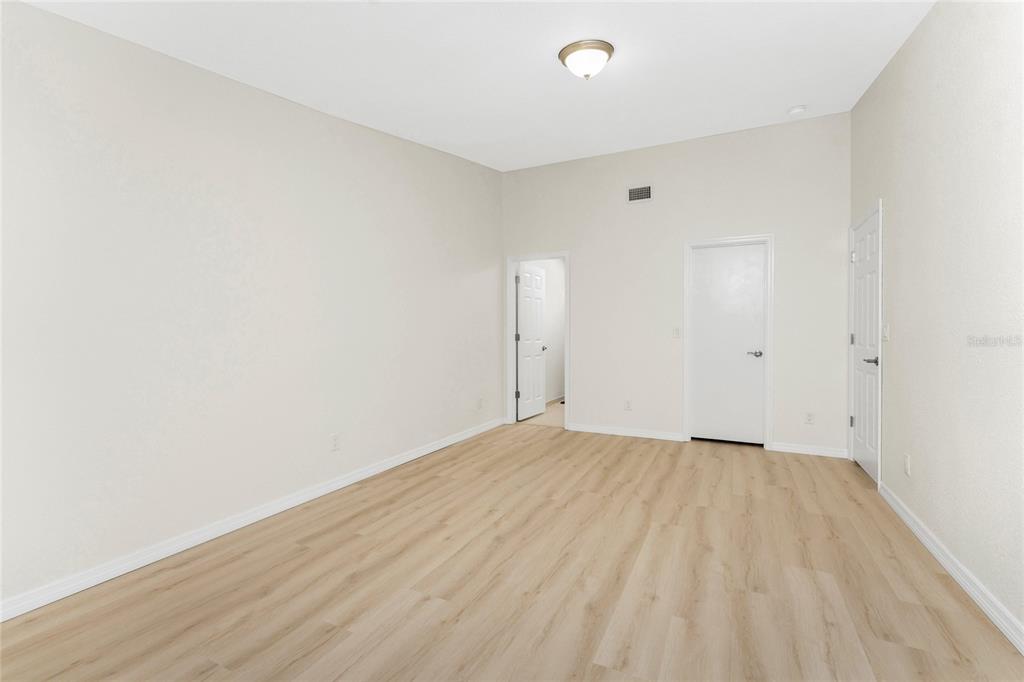 6800 Placida Road, Unit 228 Englewood, FL 34224 - Photo 23 of 45 a view of an empty room with wooden floor