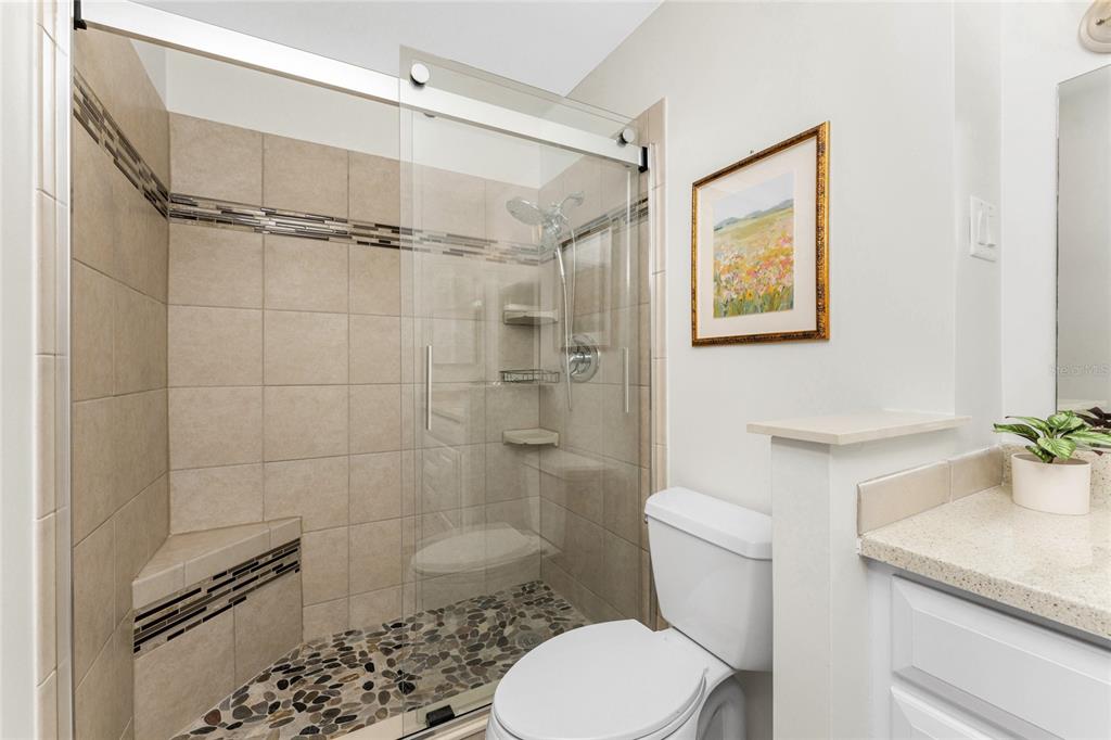 6800 Placida Road, Unit 228 Englewood, FL 34224 - Photo 25 of 45 a bathroom with a shower toilet and sink