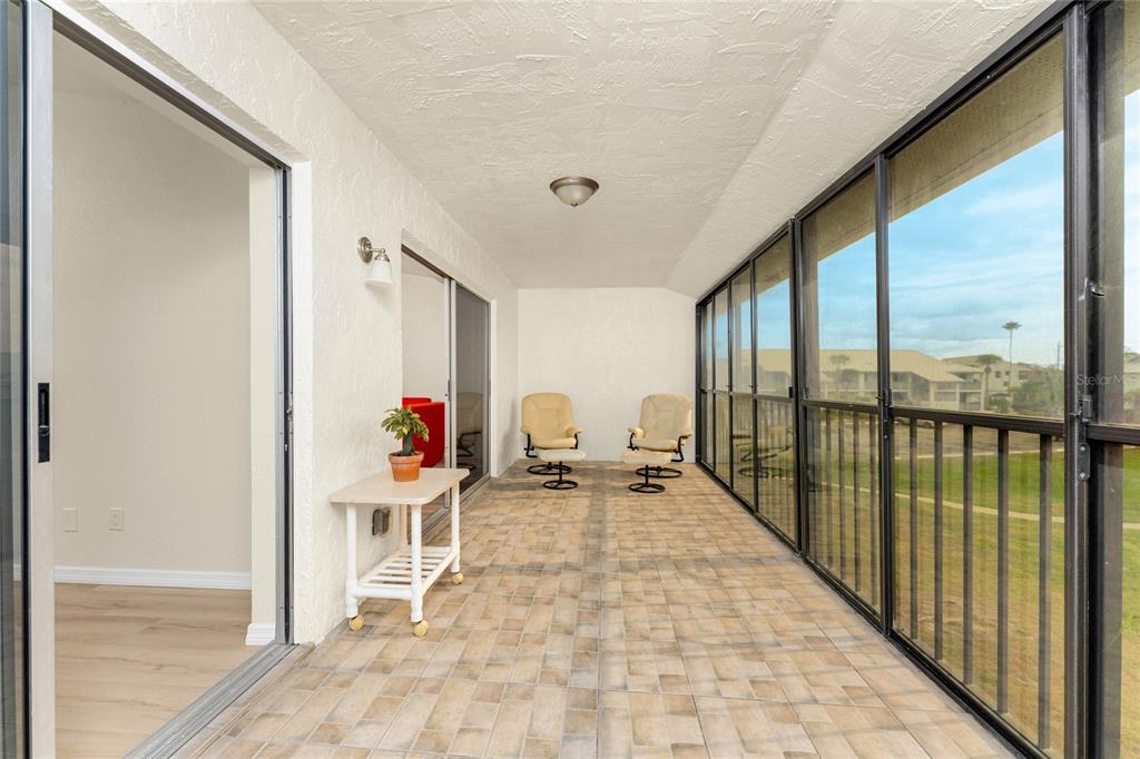 6800 Placida Road, Unit 228 Englewood, FL 34224 - Photo 27 of 45 a view of a balcony with chairs