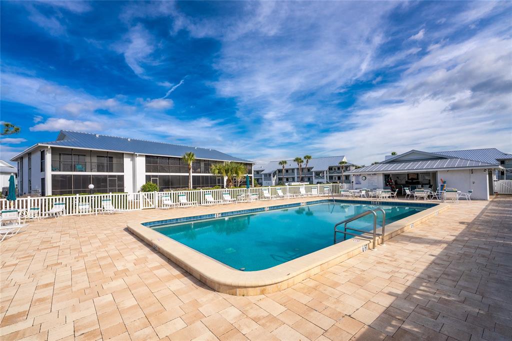 6800 Placida Road, Unit 228 Englewood, FL 34224 - Photo 3 of 45 a view of a backyard with sitting area