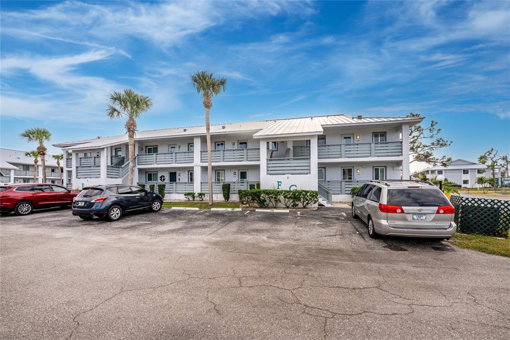 6800 Placida Road, Unit 228 Englewood, FL 34224 - Photo 32 of 45 a car parked in front of a building