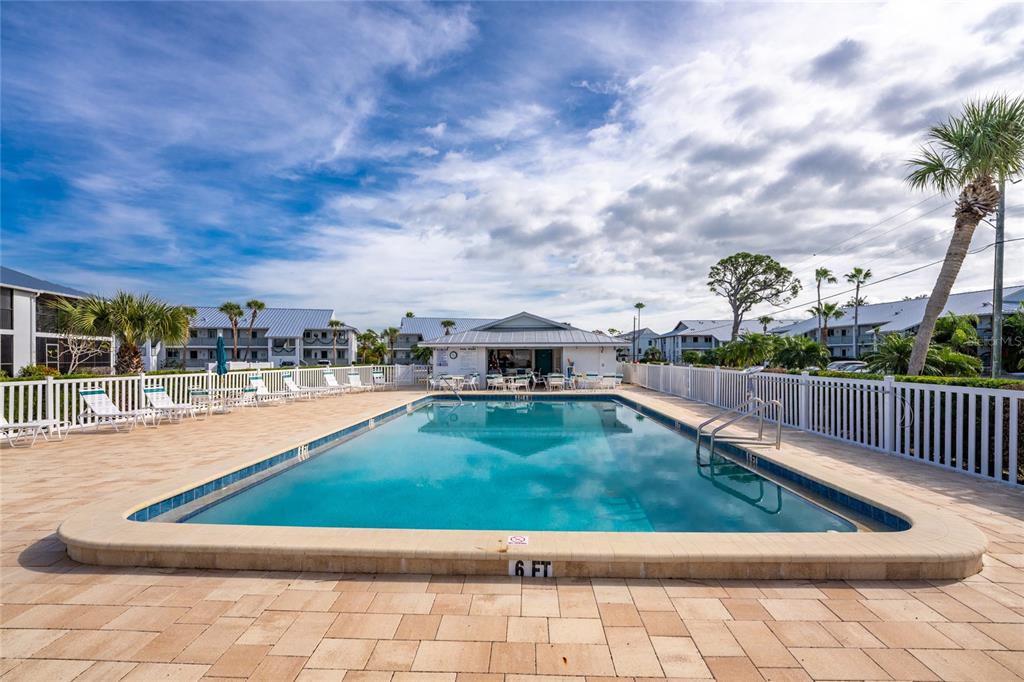 6800 Placida Road, Unit 228 Englewood, FL 34224 - Photo 35 of 45 a view of swimming pool outdoor seating