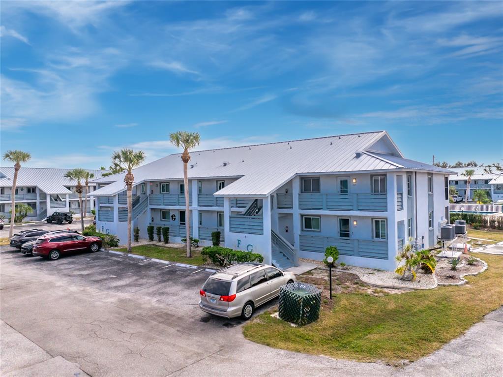 6800 Placida Road, Unit 228 Englewood, FL 34224 - Photo 39 of 45 a car parked in front of a house