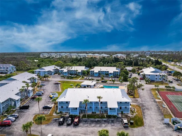 an aerial view of a house with a big yard