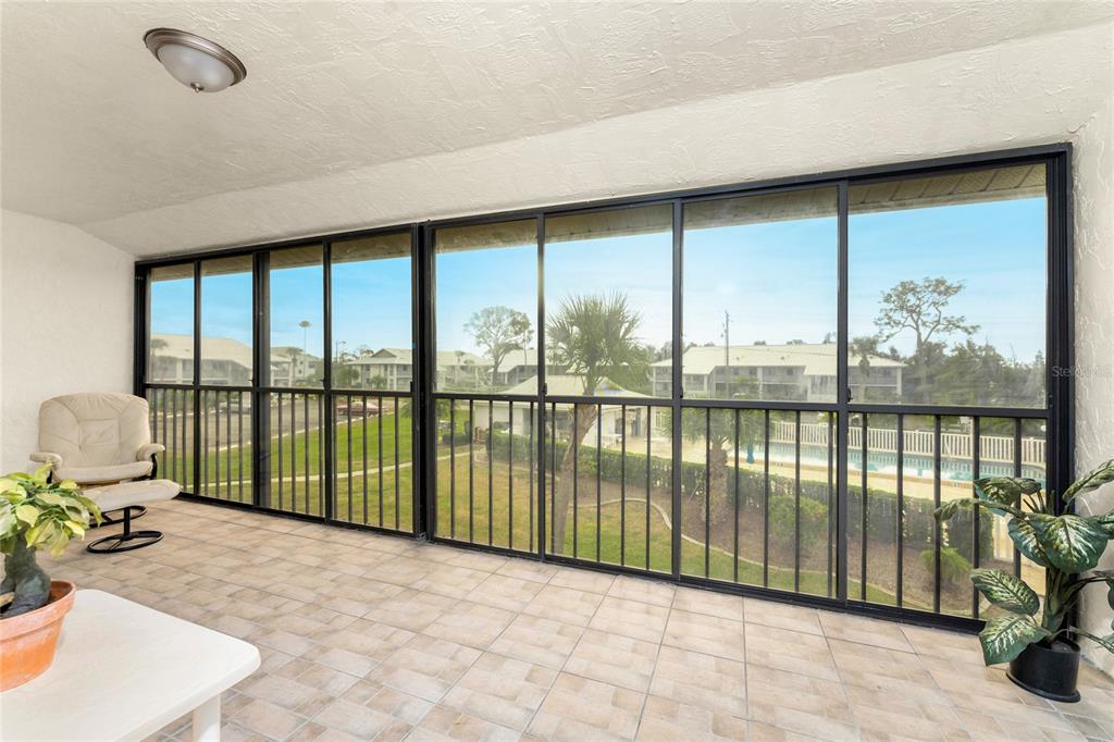 6800 Placida Road, Unit 228 Englewood, FL 34224 - Photo 4 of 45 a view of a living room and floor to ceiling window or lake