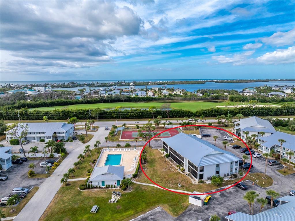 6800 Placida Road, Unit 228 Englewood, FL 34224 - Photo 42 of 45 an aerial view of a house with a big yard