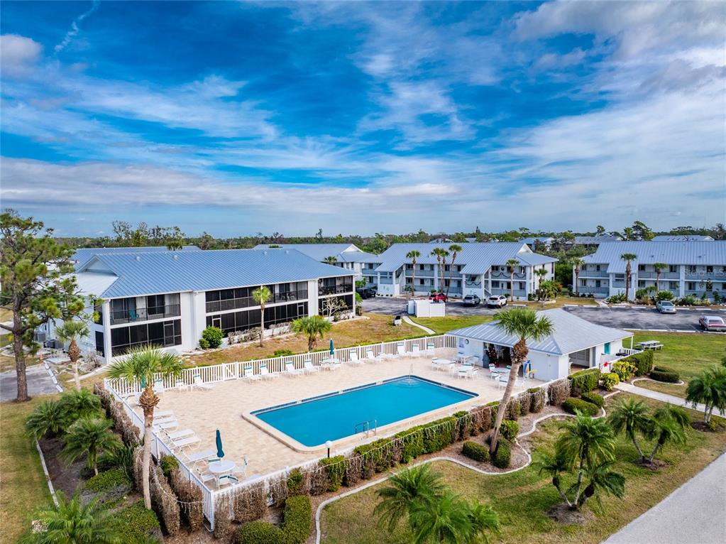 6800 Placida Road, Unit 228 Englewood, FL 34224 - Photo 44 of 45 a view of a swimming pool with a patio