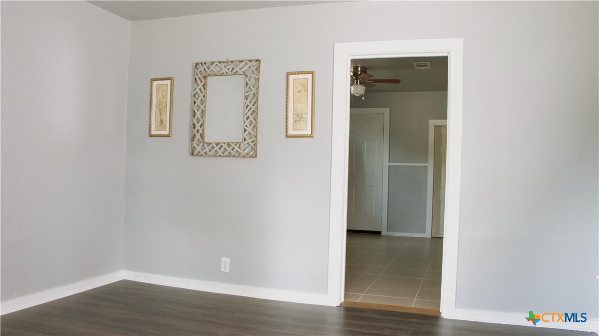 1407 South 7th Street Temple, TX 76504 - Photo 6 of 36 a view of an entryway with wooden floor