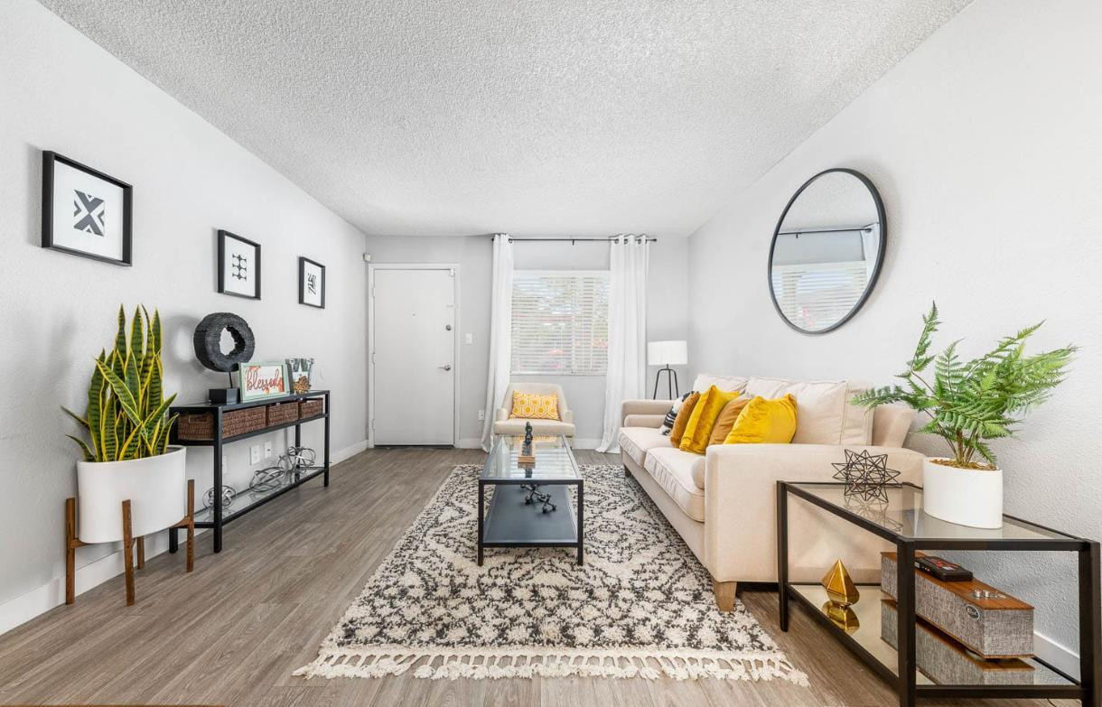 a living room with furniture and a window