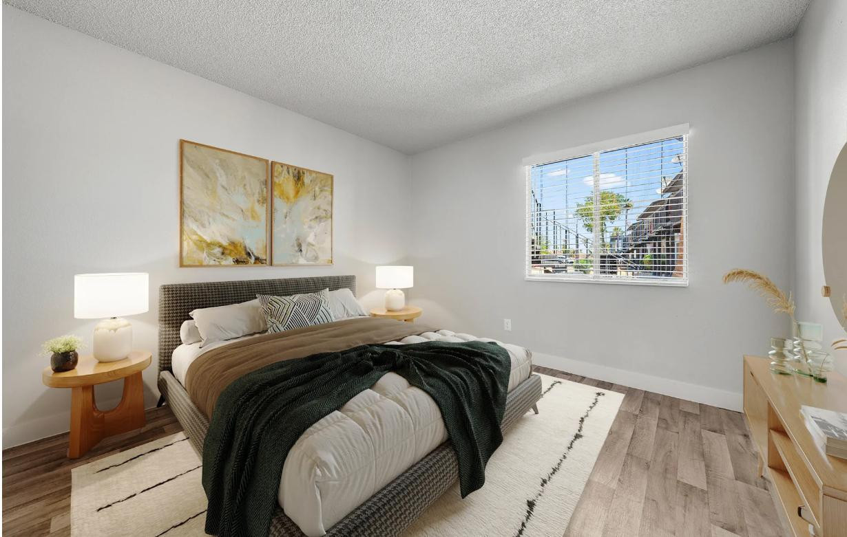 2025 West Indian School Road, Unit 1 Phoenix, AZ 85015 - Photo 6 of 12 a bed sitting in a bedroom next to a lamp