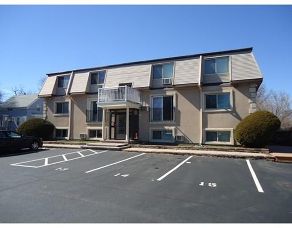 222 Stackpole Street, Unit 15 Lowell, MA 01852 - Photo 1 of 16 a view of a building with a street