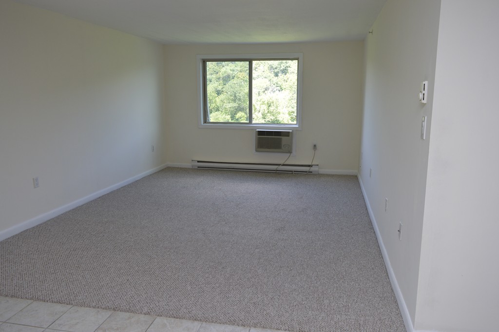 222 Stackpole Street, Unit 15 Lowell, MA 01852 - Photo 10 of 16 an empty room with a window