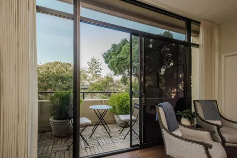 a view of a chair and table in the balcony