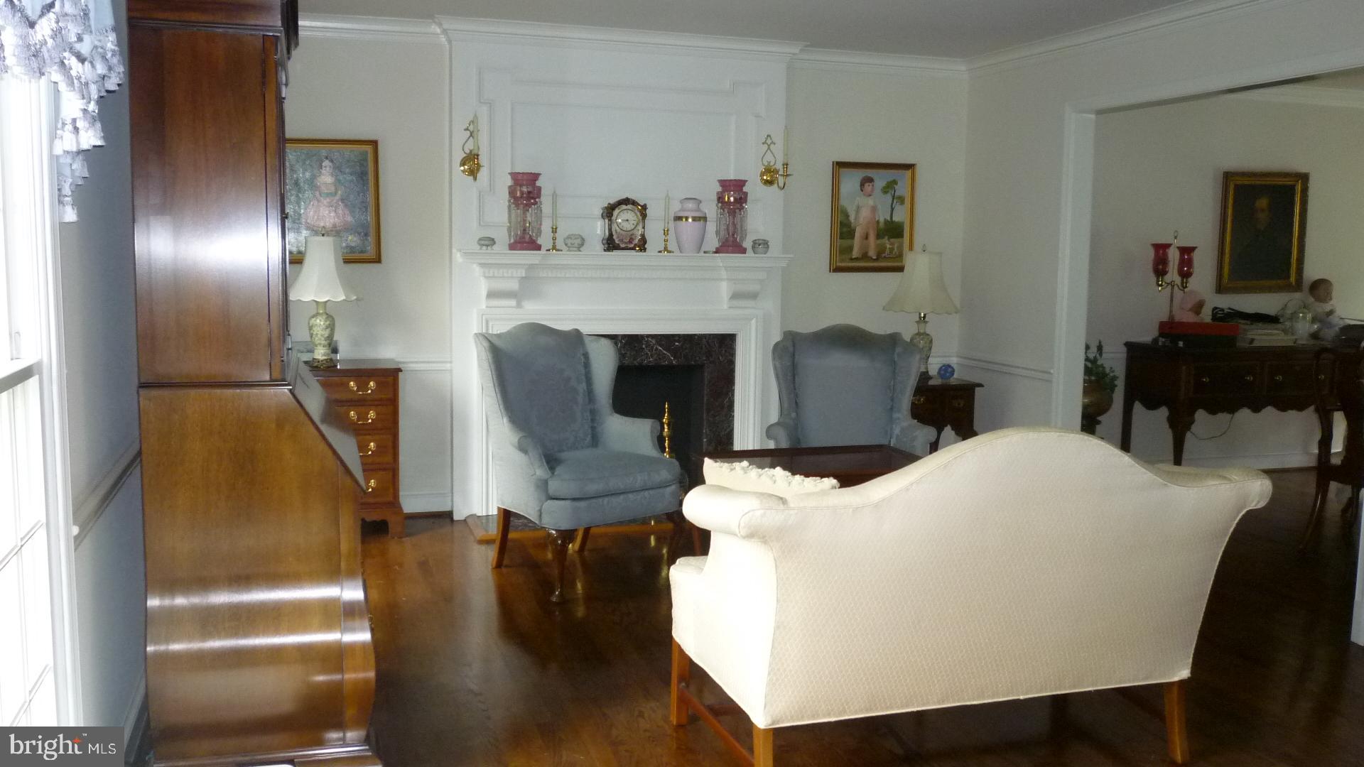17300 Twin Ridge Court Silver Spring, MD 20905 - Photo 13 of 57 Living Room with Hardwood Floors and Fireplace