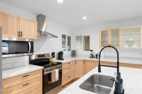 a bedroom with a bed and a table