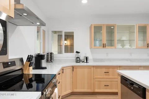 a bedroom with a bed and flat screen tv