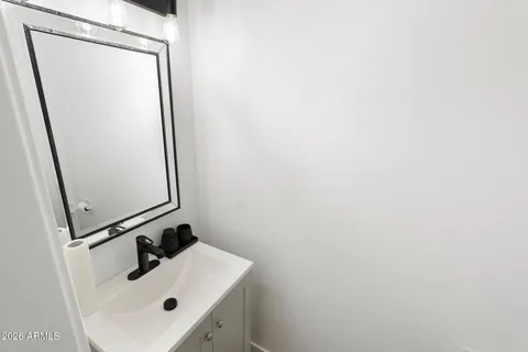 a bedroom with a bed couch and a window