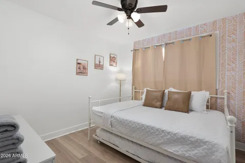 a bedroom with a bed and a couch