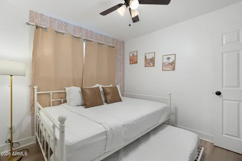 a bedroom with a bed and a couch