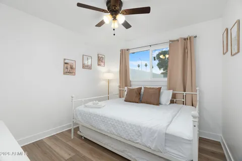 a bedroom with a bed and a couch