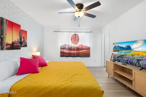 a bedroom with a bed and a couch