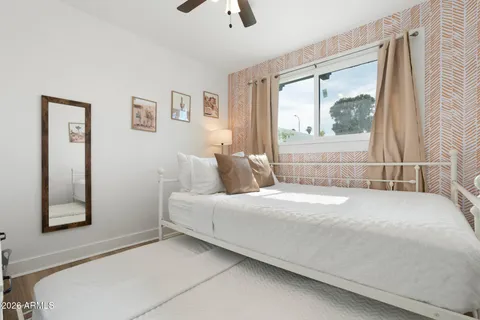 a living room with furniture and a rug