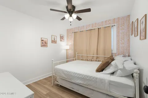 a bathroom with a sink mirror vanity and toilet