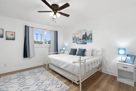 a living room with furniture a rug and a table