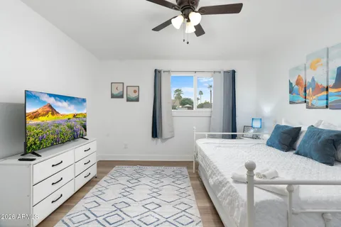 a living room with furniture and dining area