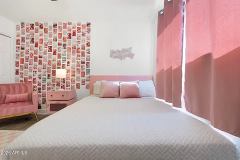 an aerial view of a swimming pool with an outdoor seating