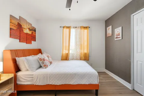 an outdoor living room with patio furniture and a potted plant