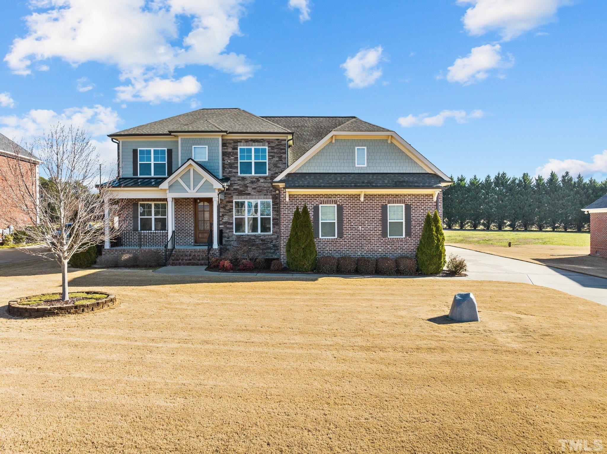 a front view of a house with a yard