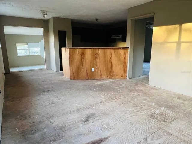 a room view with a bathroom and a mirror