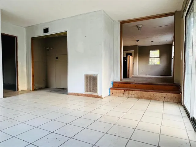 a kitchen with a refrigerator and a stove