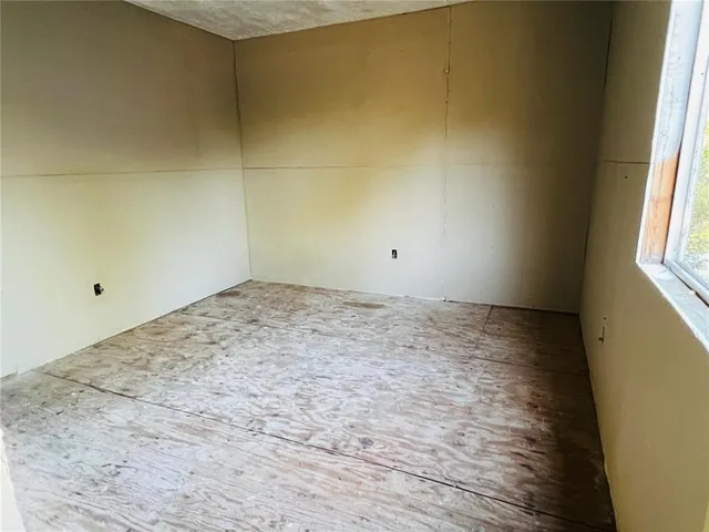 a kitchen with stainless steel appliances kitchen island granite countertop a stove and a refrigerator