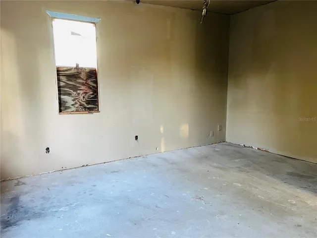 an empty room with windows