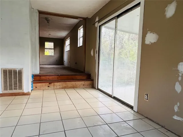a view of an empty room with a window
