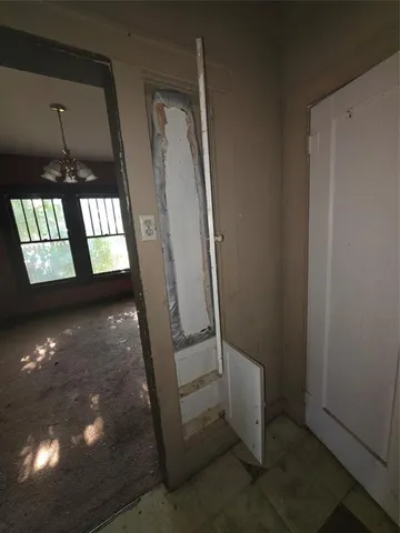 a view of an empty room and window