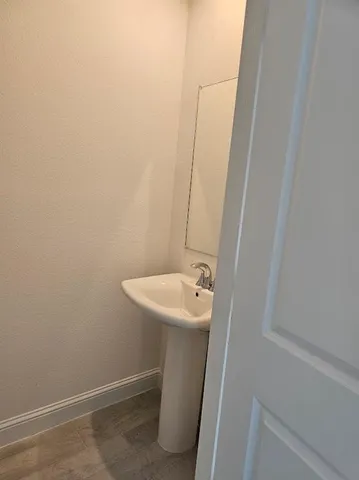 a bathroom with a sink and mirror