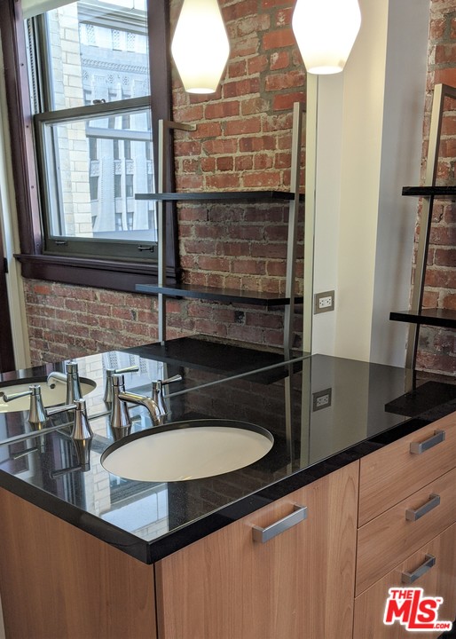 460 South Spring Street, Unit 1005 Los Angeles, CA 90013 - Photo 13 of 46 a kitchen counter top a sink and a window