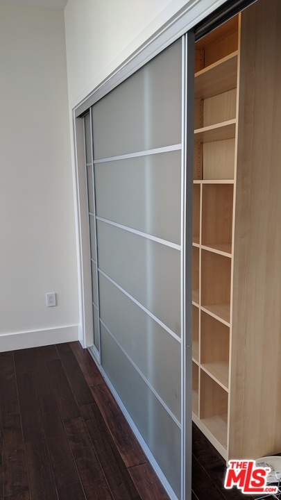 460 South Spring Street, Unit 1005 Los Angeles, CA 90013 - Photo 22 of 46 a view of walk in closet with empty racks