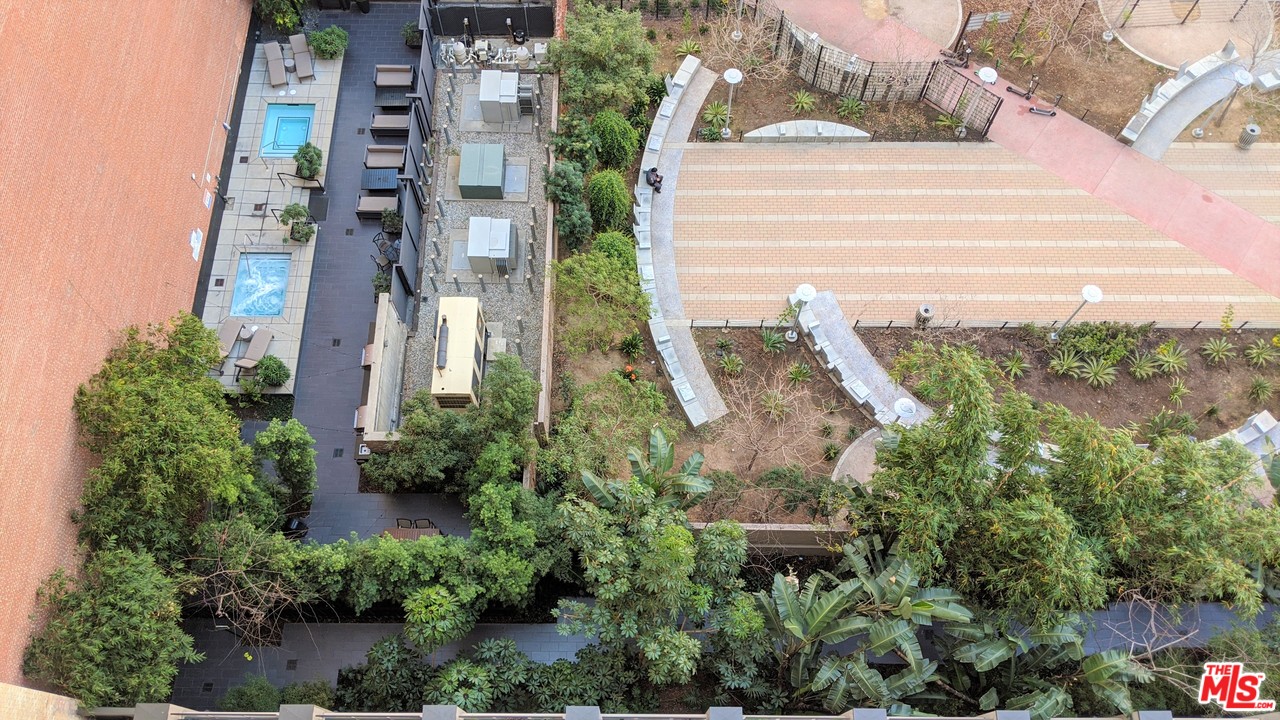 460 South Spring Street, Unit 1005 Los Angeles, CA 90013 - Photo 32 of 46 an aerial view of a multi story building with yard