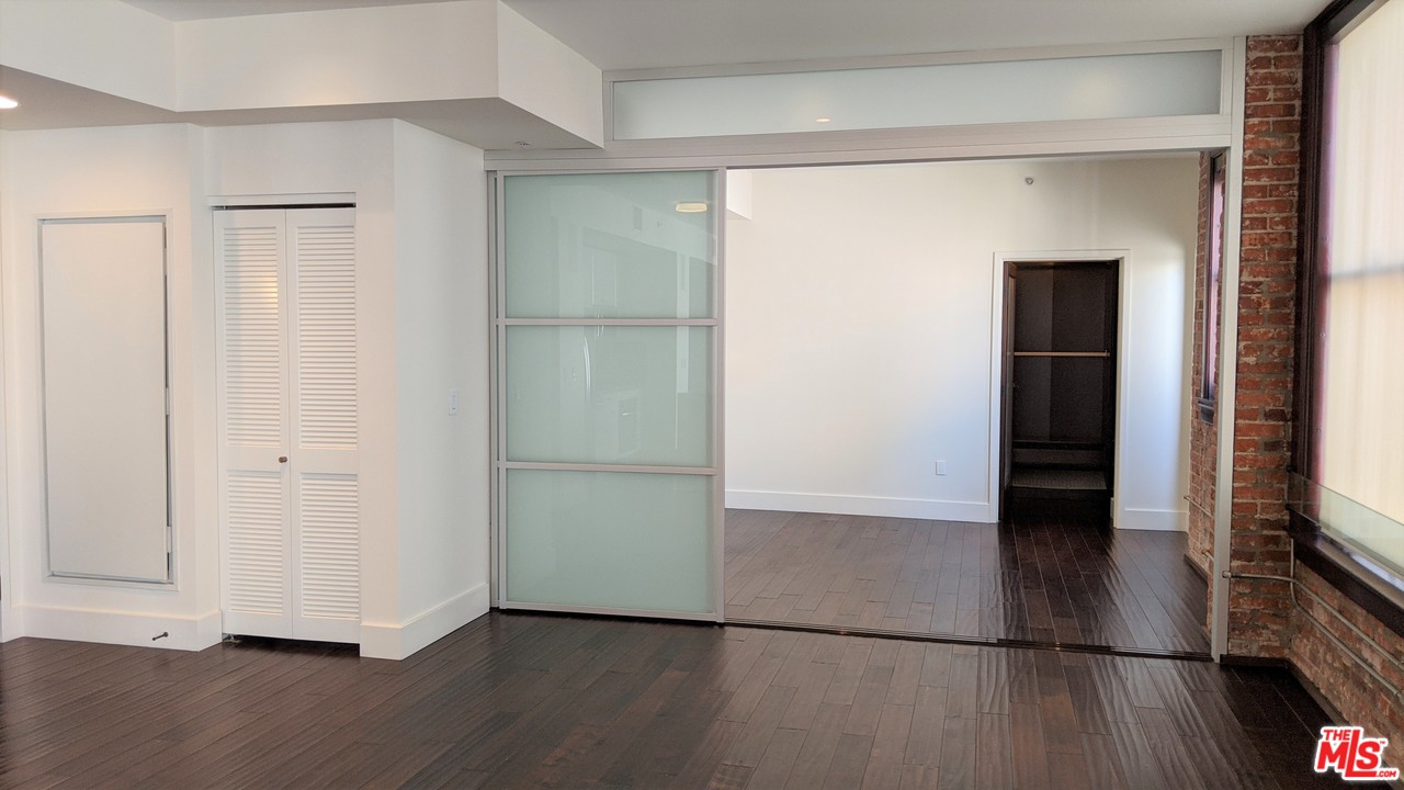 460 South Spring Street, Unit 1005 Los Angeles, CA 90013 - Photo 9 of 46 a view of a livingroom with wooden floor