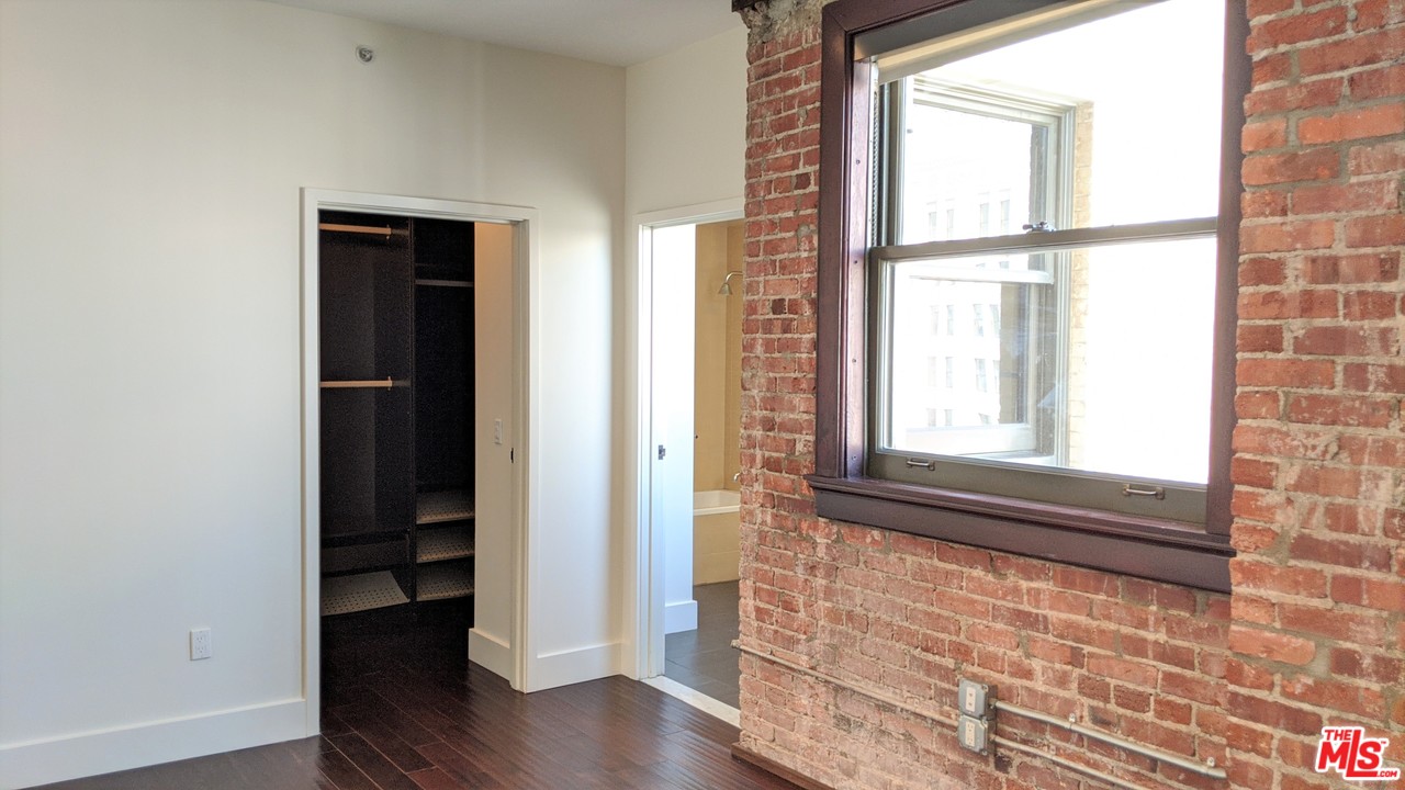 460 South Spring Street, Unit 1005 Los Angeles, CA 90013 - Photo 10 of 46 a view of front door with wooden floor