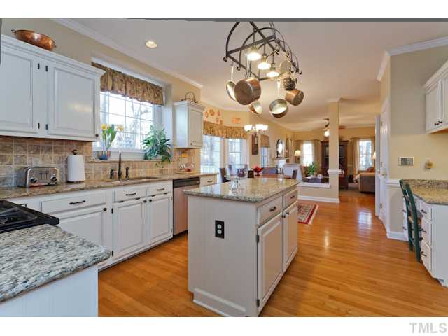 You will fall in love with this Kitchen! Center Island, Granite Counter Tops, Tumbled Tile Backsplash, Oil Rubbed Bronze Fixtures/Knobs, Stainless Appliances, Dual Over Gas Stove, & Pantry, Note the separate desk area and cabinets! Kitchen