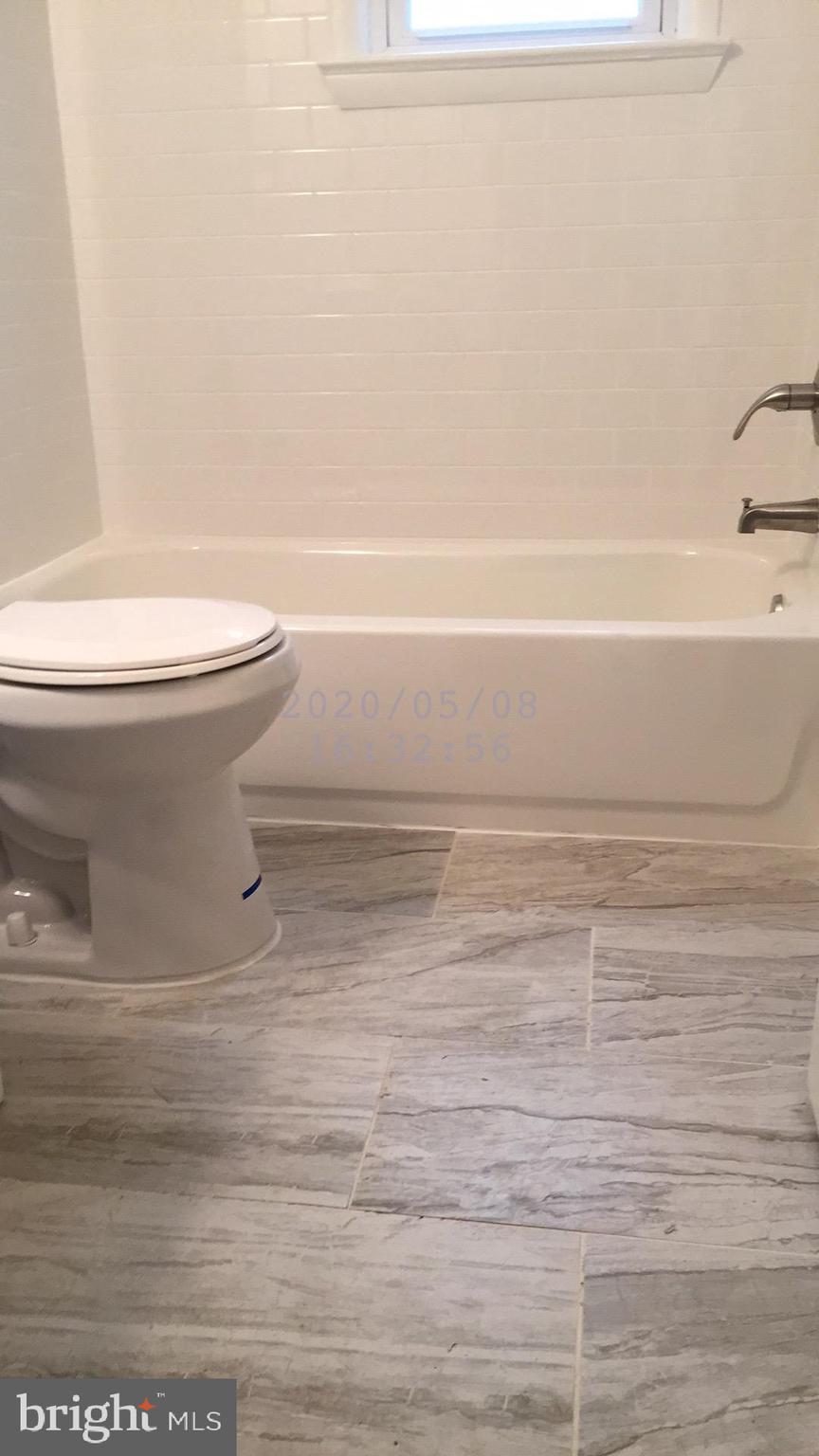 4915 Taft Road Temple Hills, MD 20748 - Photo 14 of 32 Updated Bath Floor