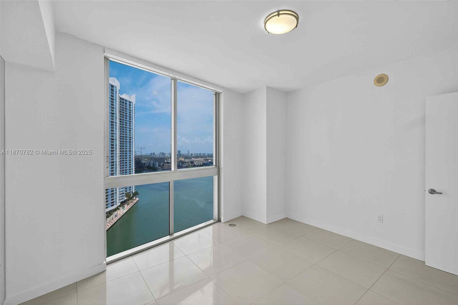 465 Brickell Avenue, Unit 2002 Miami, FL 33131 - Photo 25 of 44 an empty room with a window