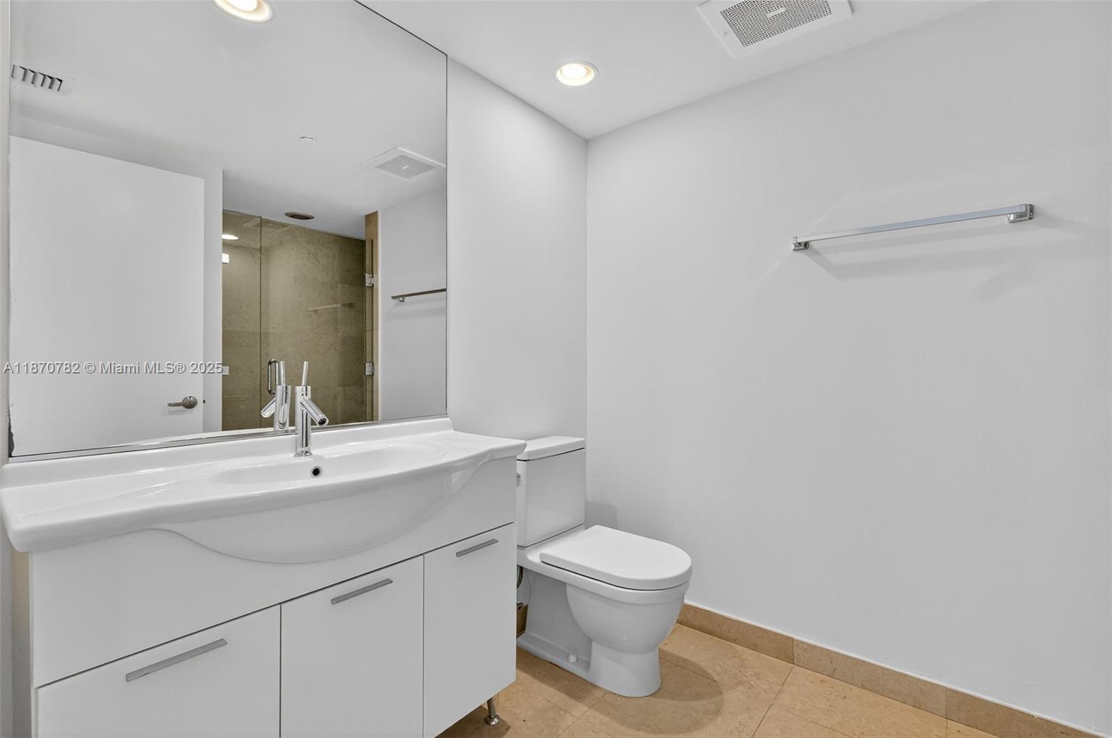 465 Brickell Avenue, Unit 2002 Miami, FL 33131 - Photo 28 of 44 a bathroom with a sink toilet and mirror