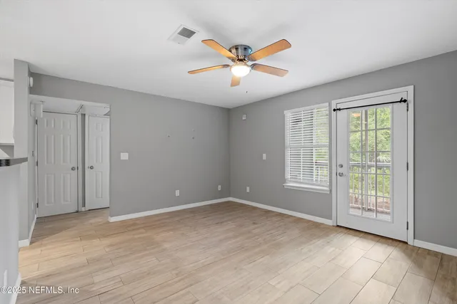 a view of an empty room with a window