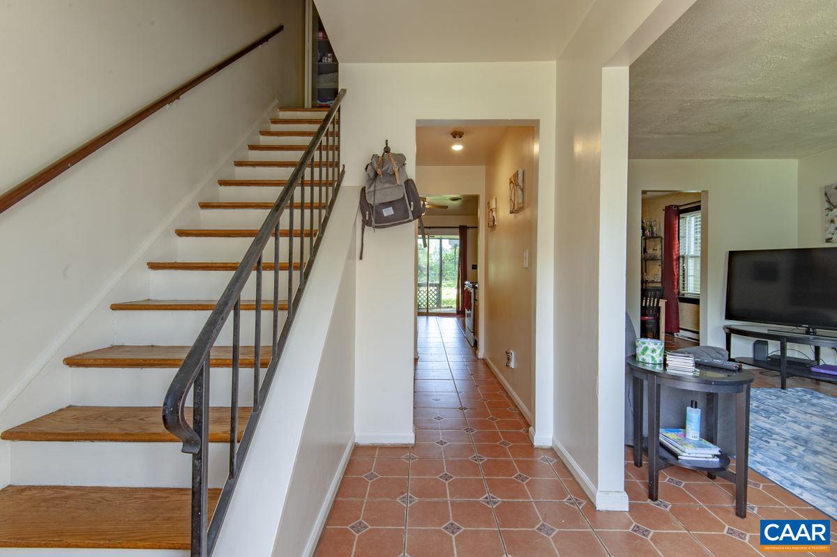 610 Bailey Road Charlottesville, VA 22903 - Photo 2 of 25 a view of a hallway with wooden floor and staircase